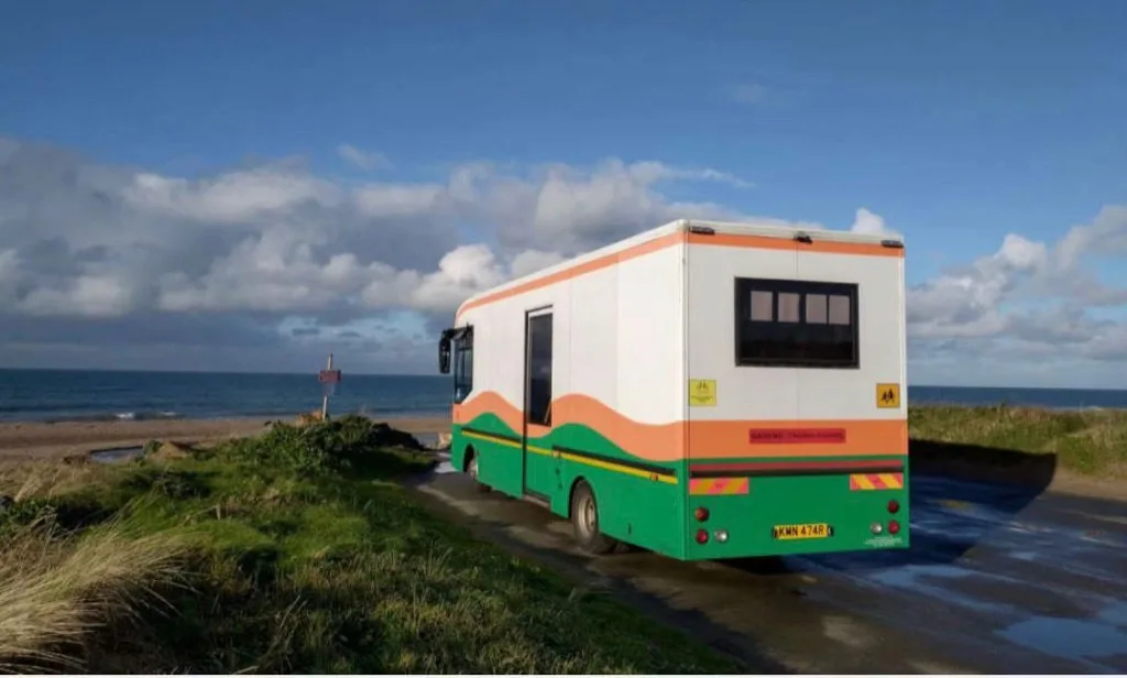 The Mobile Library bus parked by the coast